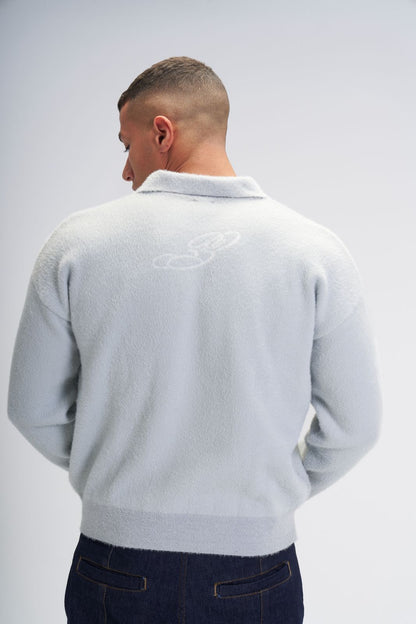 Global movement knit polo