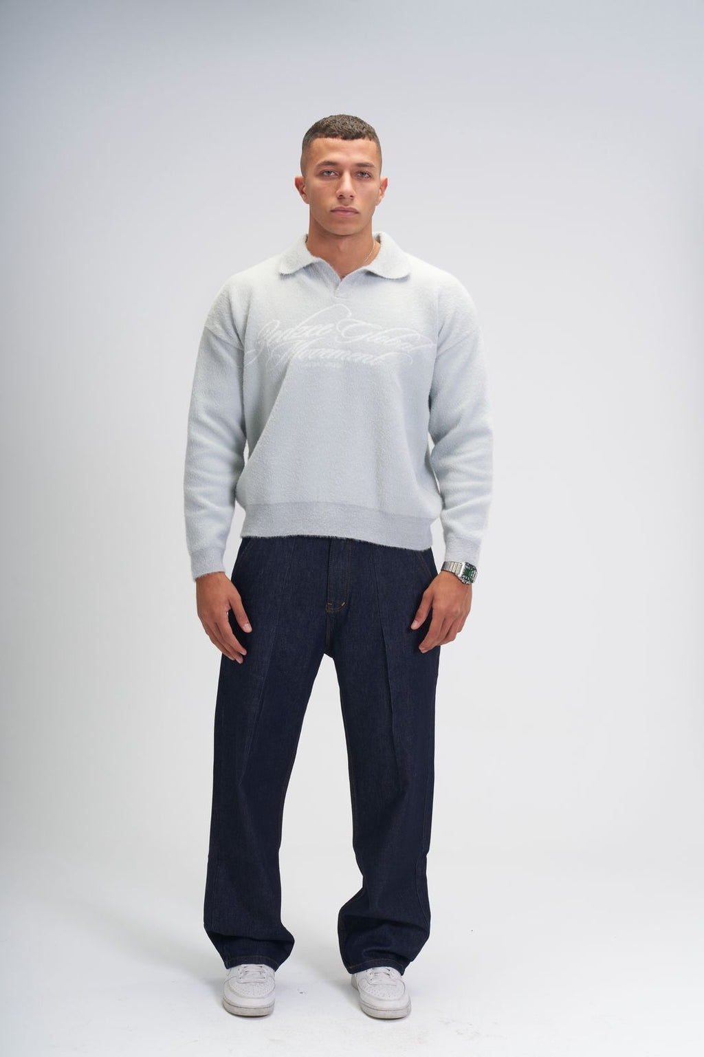 Global movement knit polo